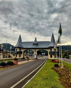 a large building on the side of a road at APARTAMENTOS BELLO VALE in Gramado