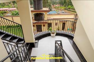 an overhead view of a staircase in a house at Luxe Furnished Apartments Unit 3 in Meru