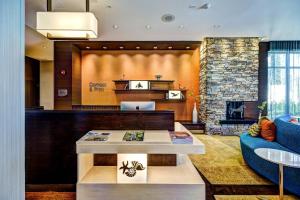 a lobby with a couch and a table at Fairfield Inn & Suites by Marriott Delray Beach I-95 in Delray Beach