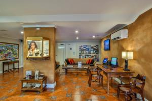 a living room with a couch and a table at Moonlight Bay Suites in Broome