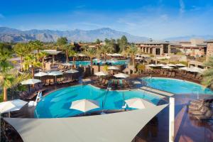 an overhead view of a resort pool with tables and umbrellas at The Westin Desert Willow Villas, Palm Desert in Palm Desert