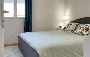 Posteľ alebo postele v izbe v ubytovaní Cozy Apartment In Mauléon Darmagnac