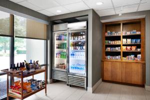 a refrigerator filled with lots of drinks in a room at SpringHill Suites by Marriott Richmond North/Glen Allen in Richmond