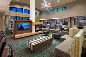 a lobby with a living room with a fireplace at Residence Inn by Marriott San Diego Chula Vista in Chula Vista