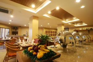 a kitchen with a bunch of fruit on a counter at Crown Regency Prince Resort in Boracay