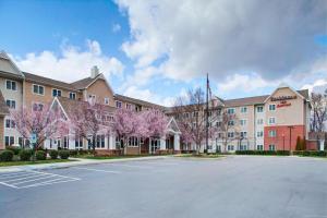 a building with a parking lot in front of it at Residence Inn by Marriott Richmond Chester in Woodvale