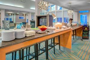 a kitchen with a counter with plates and dishes on it at Residence Inn by Marriott Richmond Chester in Woodvale