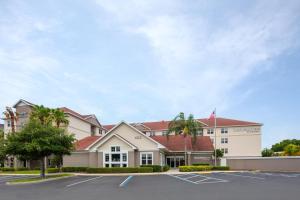 a rendering of the front of a hotel with a parking lot at Residence Inn Tampa Oldsmar in Oldsmar
