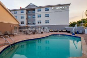 a hotel with a swimming pool in front of a building at Residence Inn Tampa Oldsmar in Oldsmar