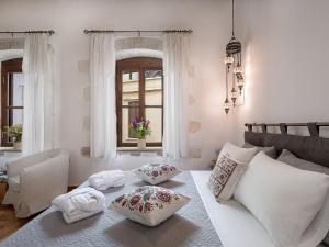 a living room with a table and a couch at Venetian Palace Chania in Chania