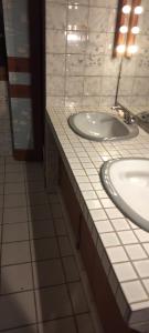 a bathroom with a sink and a mirror at Corneguerre Grand Brassac in La Peyzie