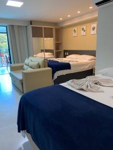 Ένα ή περισσότερα κρεβάτια σε δωμάτιο στο Tabatinga Flat - Beira Mar