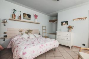 Postel nebo postele na pokoji v ubytování B&B LA MIMOSA E IL GELSOMINO