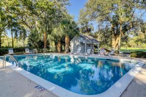 a large swimming pool with a gazebo at Queens Grant 684 in Hilton Head Island