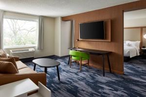 a hotel room with a desk and a bed at Fairfield Inn & Suites by Marriott Virginia Beach/Norfolk Airport in Virginia Beach