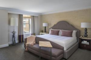 a hotel room with a bed and a couch at Marriott Vacation Club® at the Mayflower, Washington, D.C.  in Washington