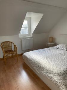 Łóżko lub łóżka w pokoju w obiekcie Les Galets, maison avec terrasse