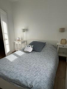 Łóżko lub łóżka w pokoju w obiekcie Les Galets, maison avec terrasse