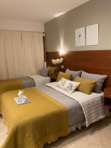Postel nebo postele na pokoji v ubytování Hostal Alto Ayre Salta + 30 fotografií