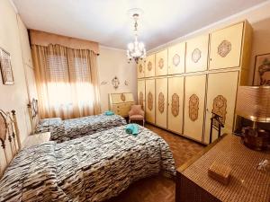 A bed or beds in a room at Affittacamere Umberto&Marisa