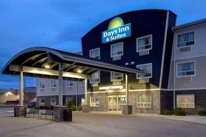 a building with a sign that reads days inn and suites at Days Inn & Suites by Wyndham Warman Legends Centre in Warman