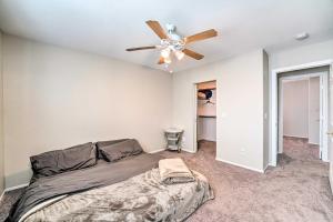 a bedroom with a bed and a ceiling fan at Stylish House with Patio, 8 Mi to Vegas Strip! in Las Vegas
