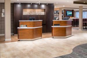 a lobby of a hotel with a reception desk at Courtyard by Marriott Portland North in Portland