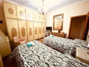 A bed or beds in a room at Affittacamere Umberto&Marisa