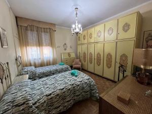 A bed or beds in a room at Affittacamere Umberto&Marisa