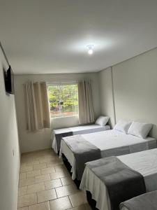 En eller flere senge i et værelse på Hotel San Lucas