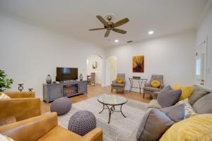 a living room with a couch and a tv at Fredericksburg Home with Pool about 1 Mi to Main Street! in Fredericksburg