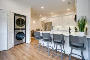 a kitchen with a counter and stools in a room at Fredericksburg Home with Pool about 1 Mi to Main Street! in Fredericksburg