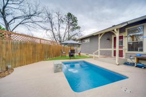 a swimming pool in the backyard of a house at Fredericksburg Home with Pool about 1 Mi to Main Street! in Fredericksburg