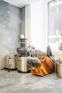 a kitchen counter with a cutting board and utensils at Basement Master Bedroom in Mississauga