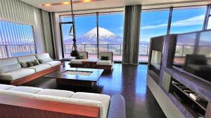 a living room with a view of a mountain at Miru Nozomi Views in Niseko