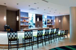 a bar in a hotel lobby with chairs and a counter at TownePlace Suites by Marriott Bellingham in Bellingham