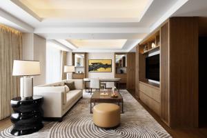 a living room with a couch and a table at JW Marriott Hotel Nara in Nara