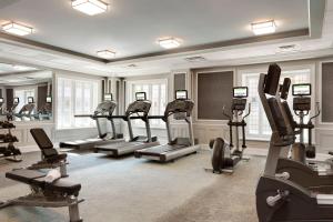 a gym with treadmills and ellipticals in a room at Courtyard St. Louis Downtown/Convention Center in Saint Louis