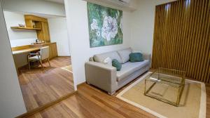 a living room with a couch and a table at Salta Suite in Salta