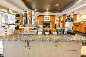 a kitchen with a counter top with a counter top at TownePlace Suites by Marriott Gilford in Gilford