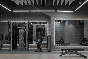 un gimnasio con varias máquinas de correr y espejos en The Dorian, Autograph Collection, en Calgary