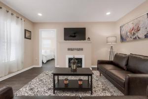 a living room with a couch and a fireplace at Large Kitchen Near Shops Easy Highway Access in Chico