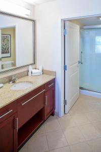 a bathroom with a sink and a mirror at Residence Inn by Marriott Moncton in Moncton