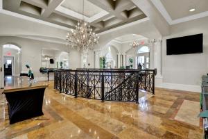 a large room with a chandelier and a lobby at Vasari Country Club #201 - Toscana Treasure in Bonita Springs