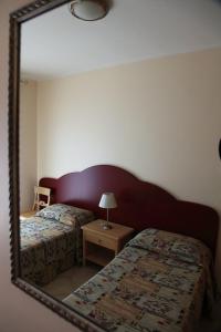 Letto o letti in una camera di Hotel Teti