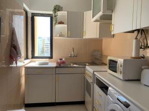 Kuchyň nebo kuchyňský kout v ubytování Apartamento aconchegante, Portimão Praia da Rocha