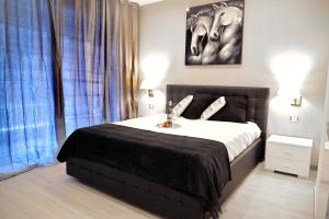 A bed or beds in a room at Gregori Guest House