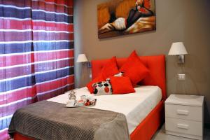 A bed or beds in a room at Gregori Guest House