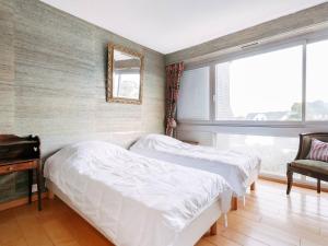 Posteľ alebo postele v izbe v ubytovaní Carnac - Appartement 4 pièces - 85m² - Face mer - WIFI - Garage - FR-1-477-226