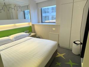 Cama o camas de una habitación en Dorsett Tsuen Wan, Hong Kong